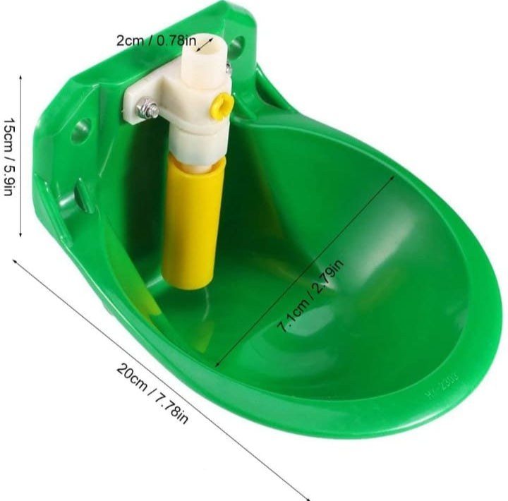 A green goat drinker bowl with a yellow water dispenser, shown in use by goats in a pen.